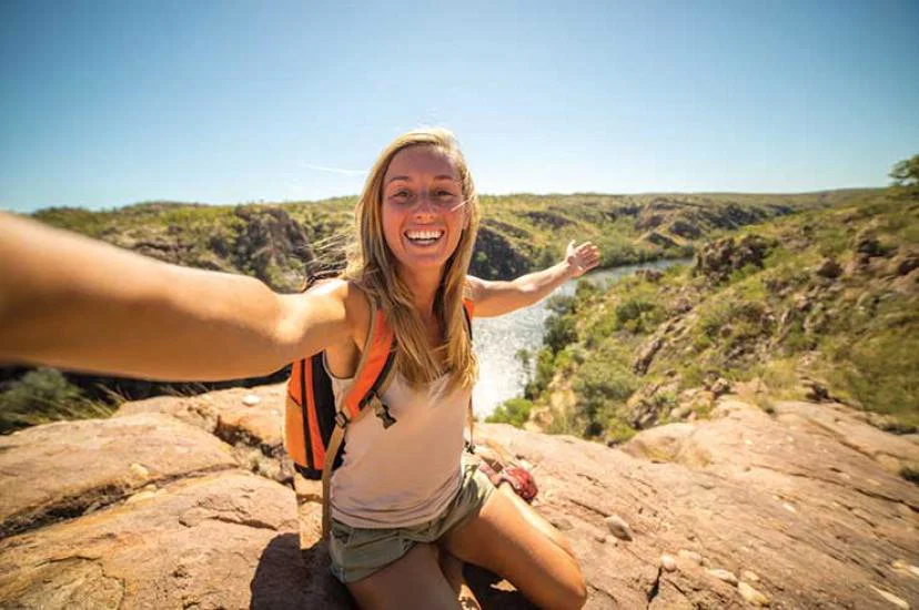 Woman filming a video when travelling