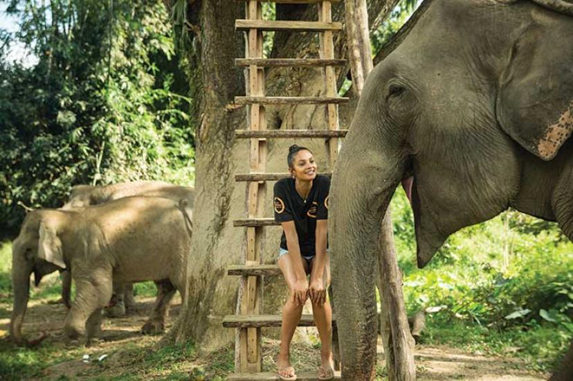 Alesha smiling with Lotus at Boon Lotts Elephant Sanctuary in Thailand