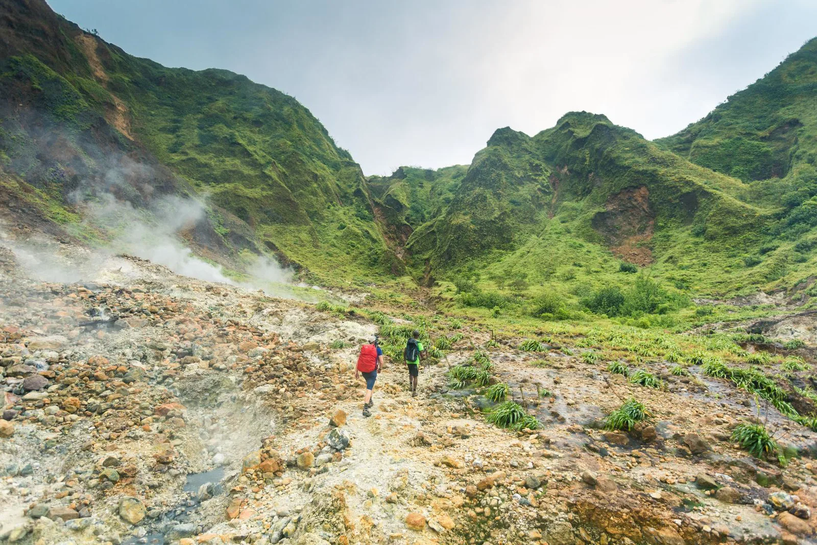 Two hikers on a trail in Dominica