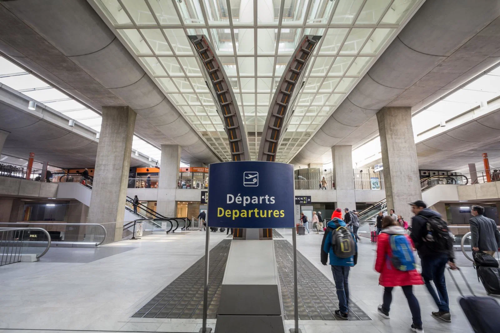 People head to the departure gates at Paris's Charles de Gaulle airport