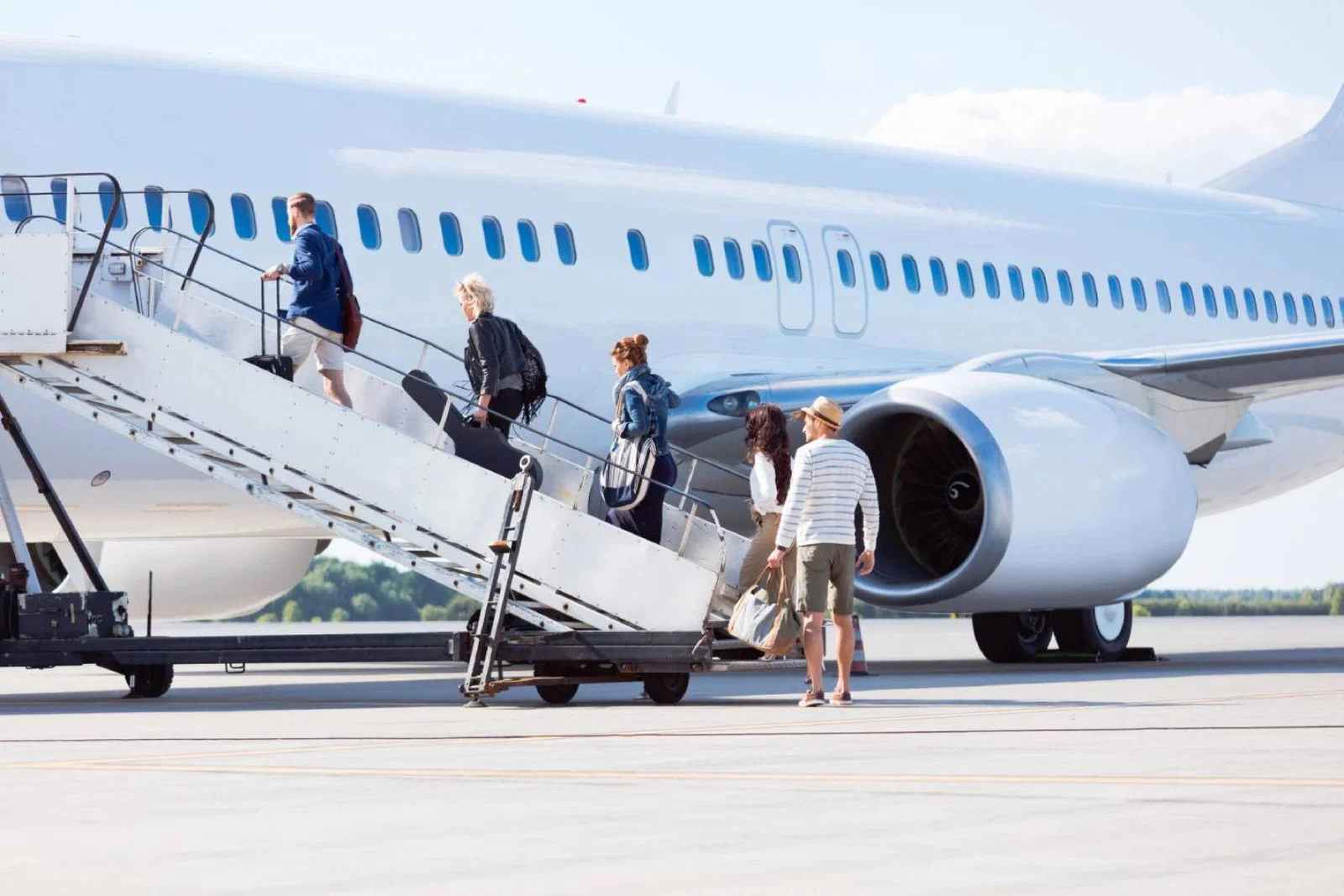 Travellers boarding a plane