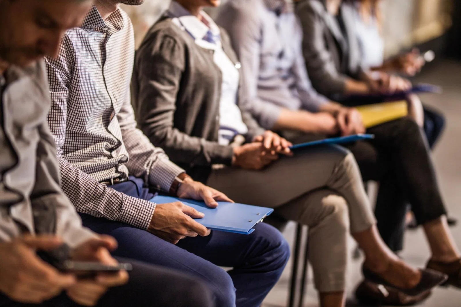 Job candidates wait to be seen for roles