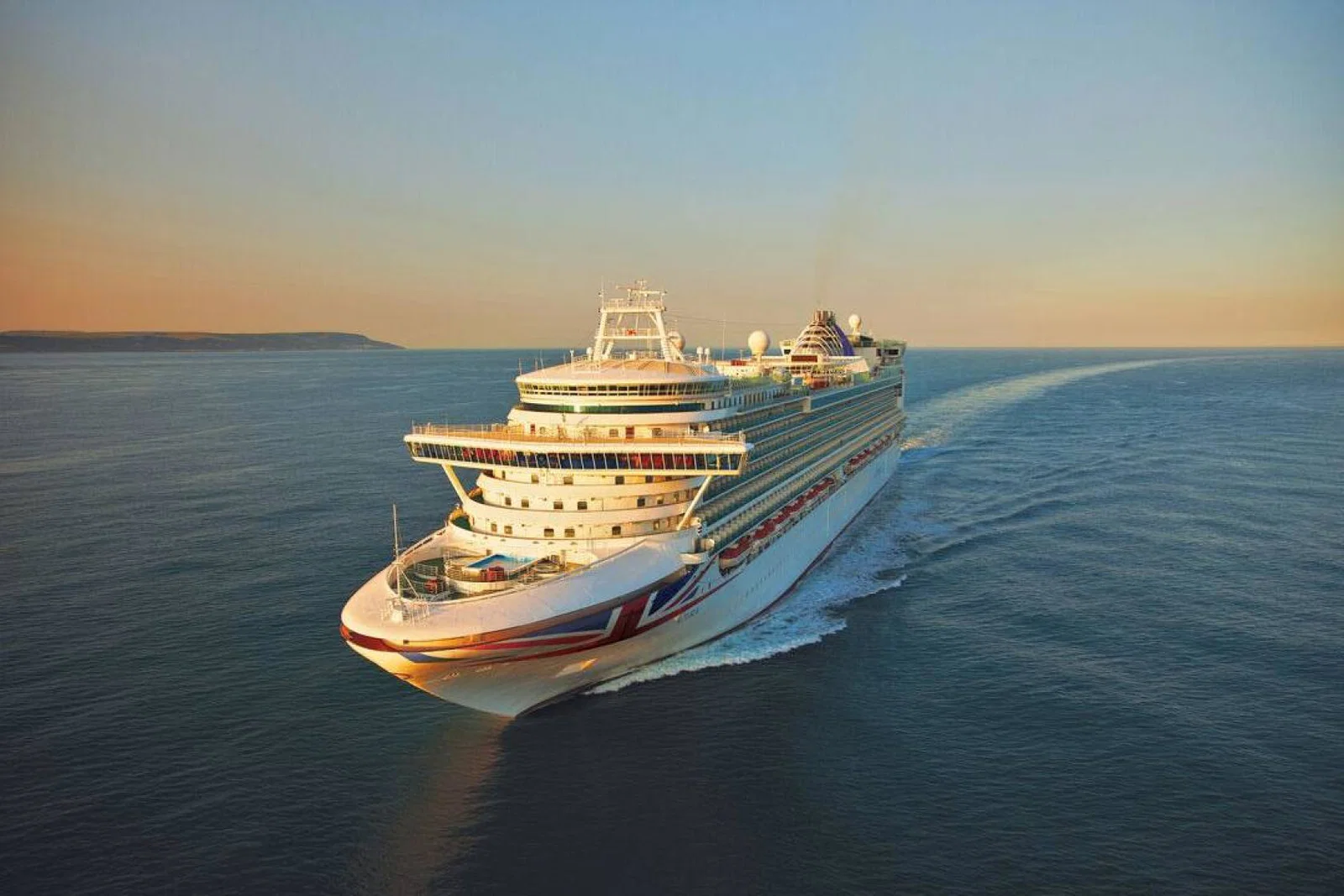 P&O cruise ship sailing on open water during sunset