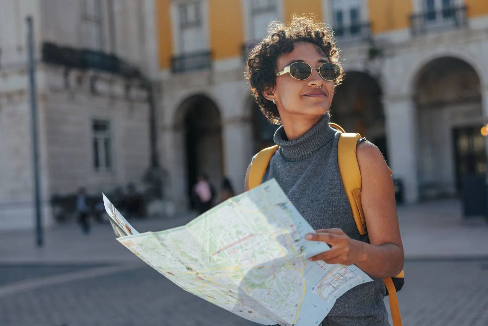Female traveller looking at a map in Lisbon