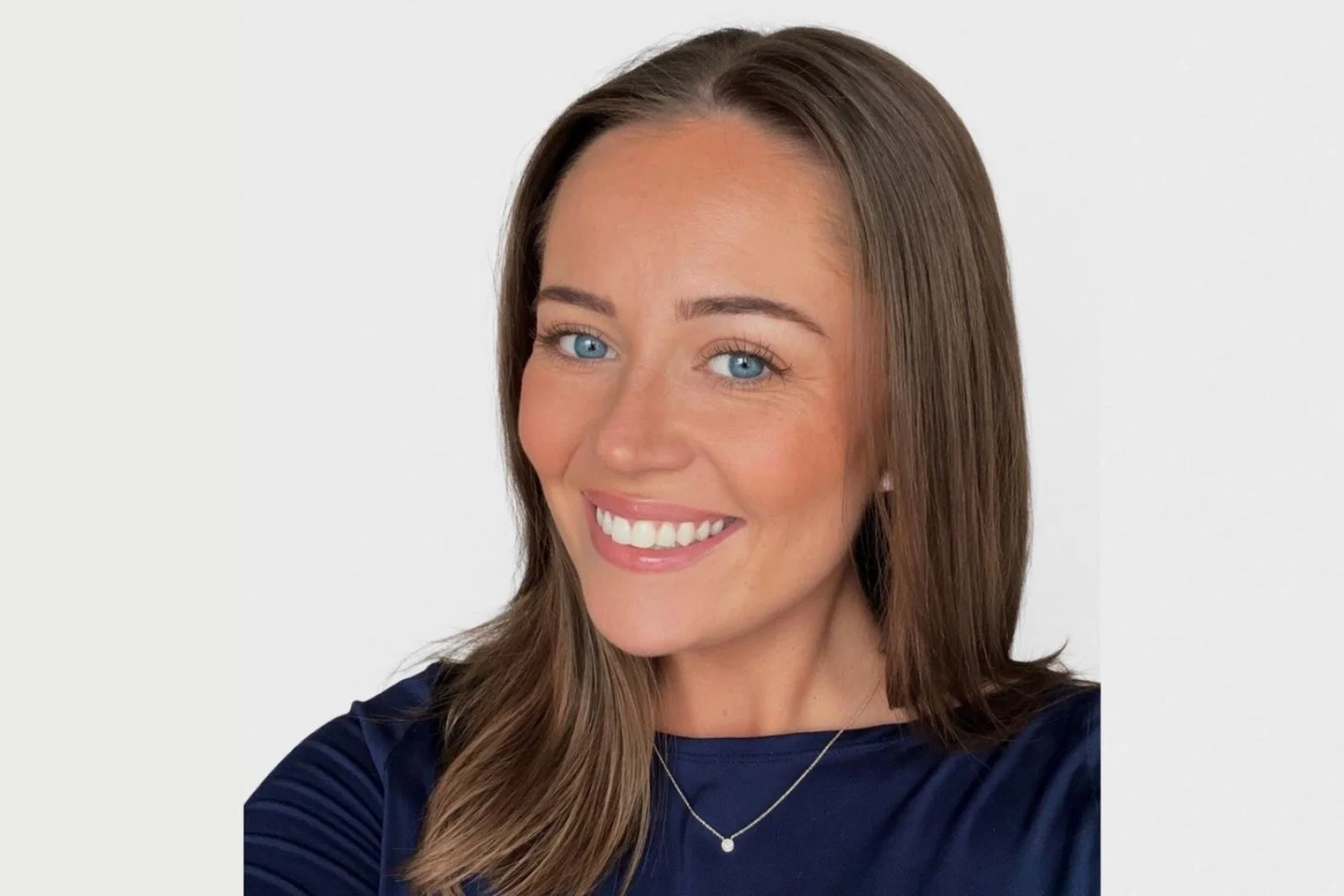 Woman smiling with brown hair 