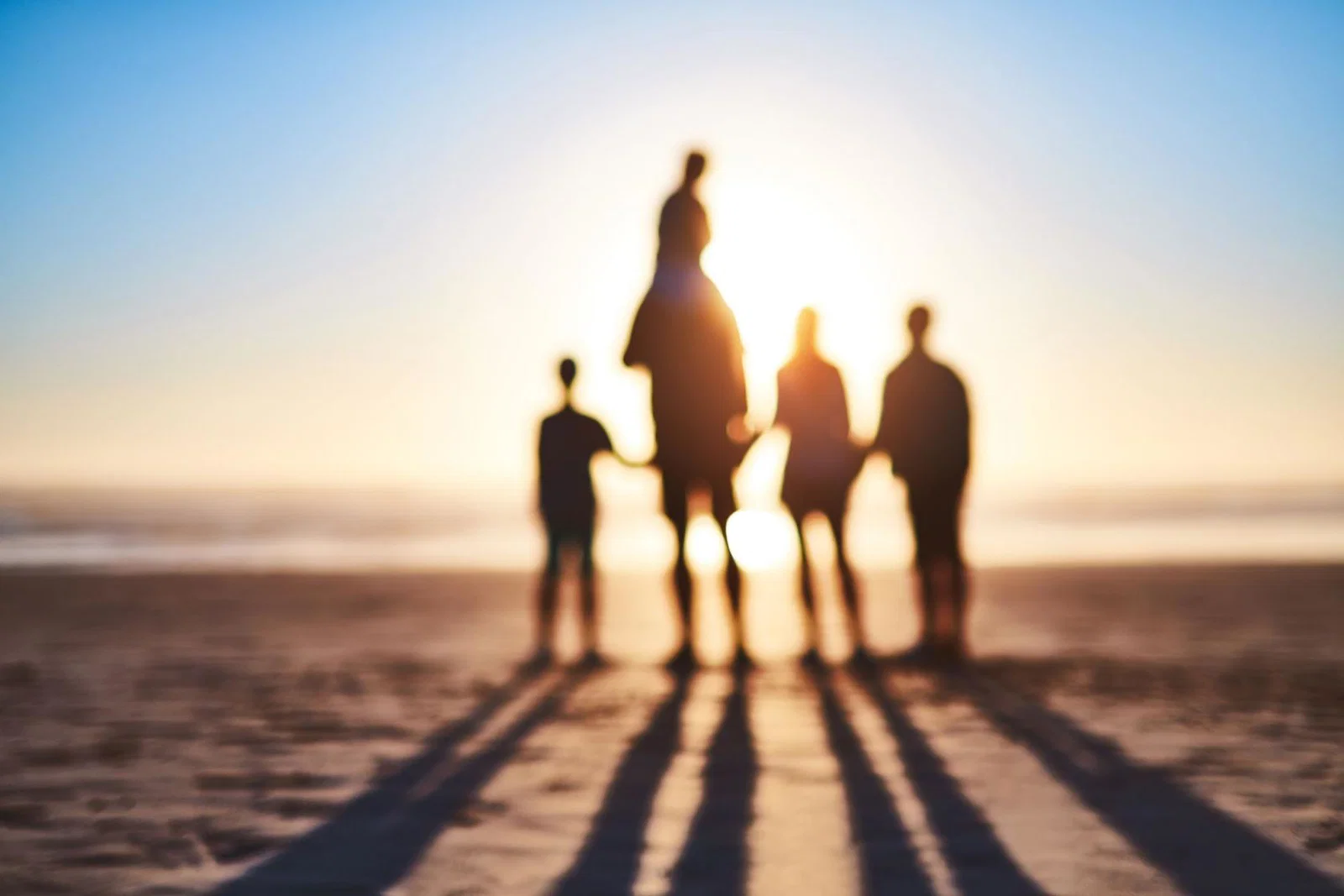 A family play on the beach