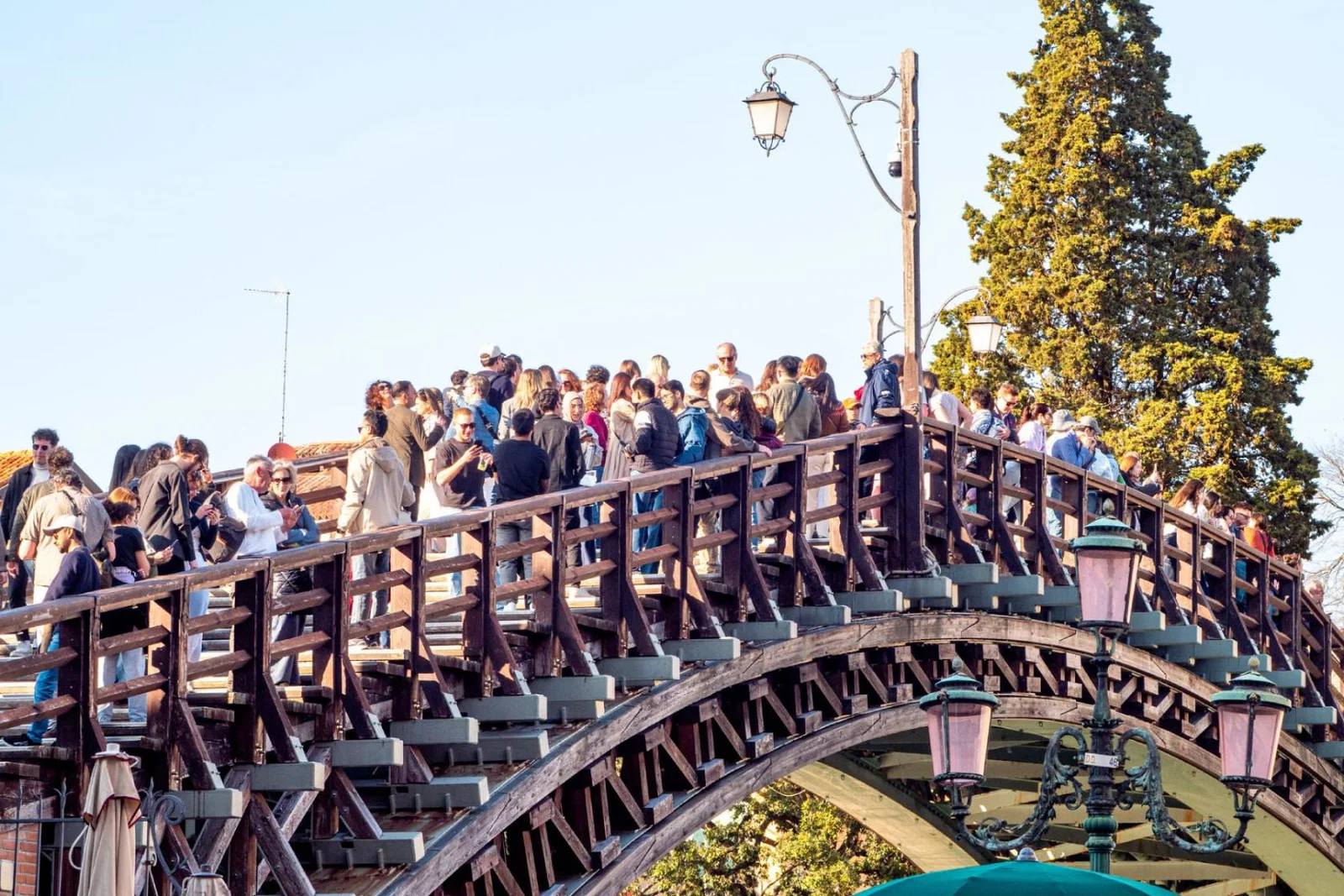Tourists gather on Venice's Accademia Bridge