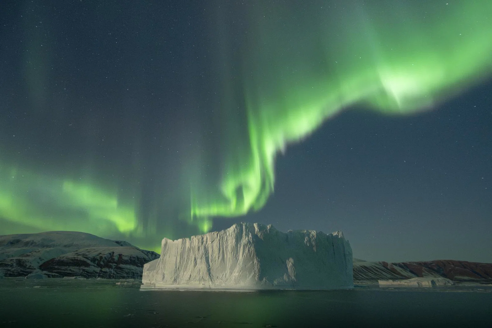 Secret Atlas voyages depart in September at the best time for encountering the Scoresbysund Northern Lights. Photographer Virgil Reglioni