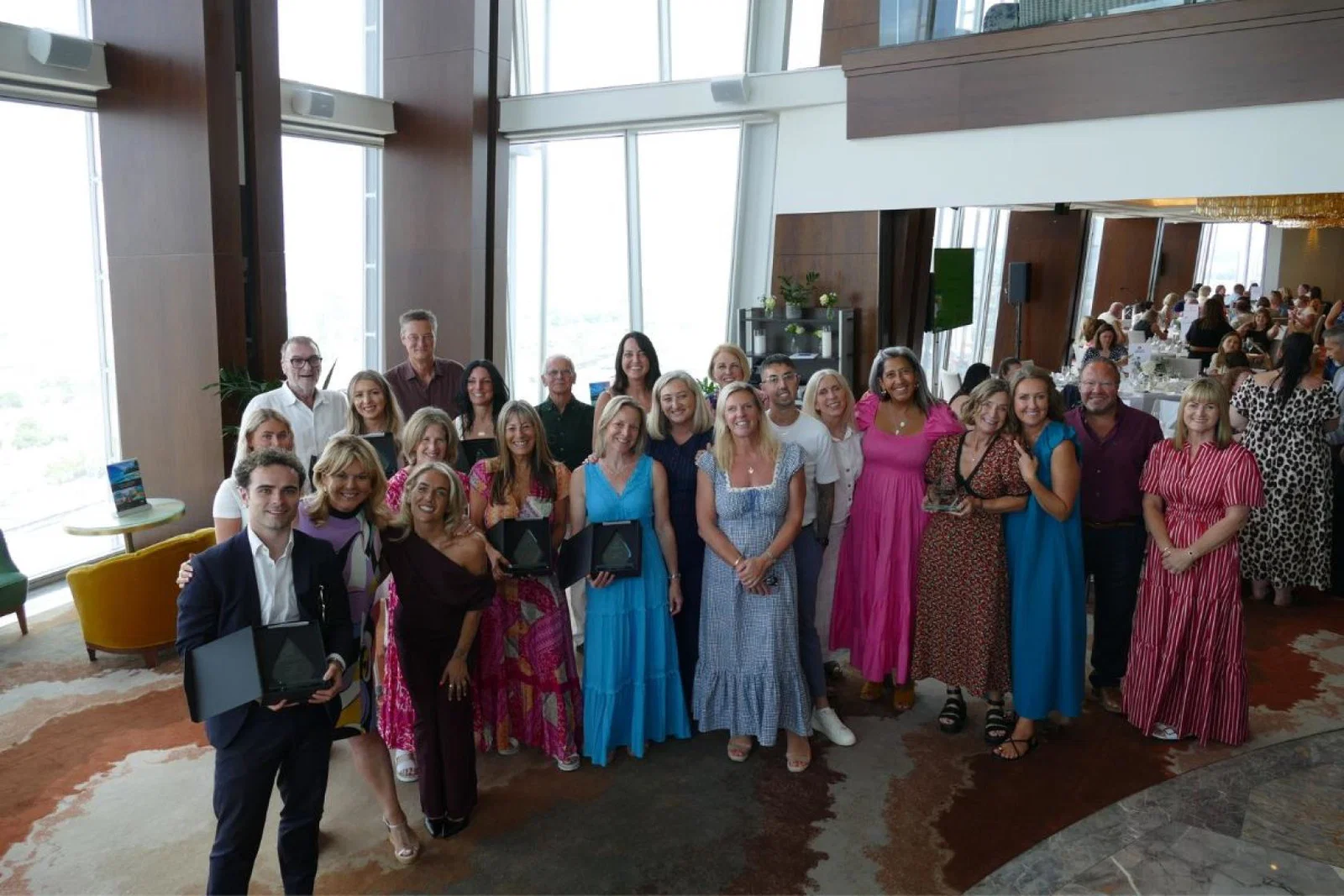 Group of people holding awards 