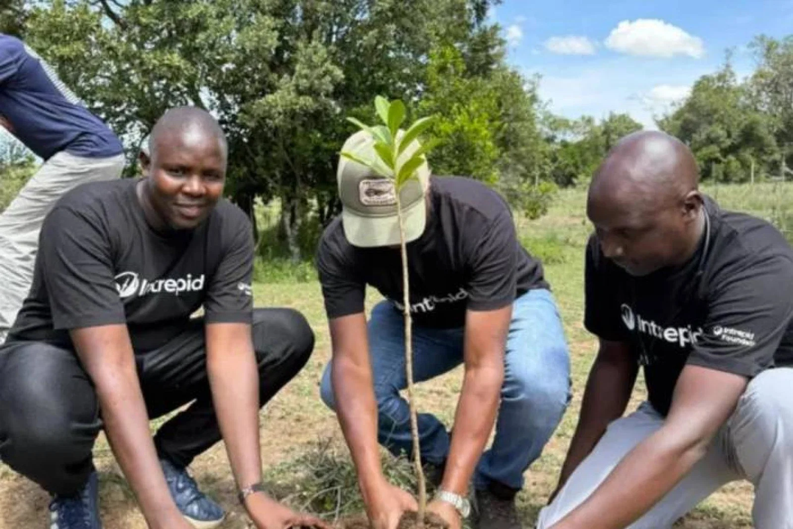 Intrepid travel team planting trees in East Africa