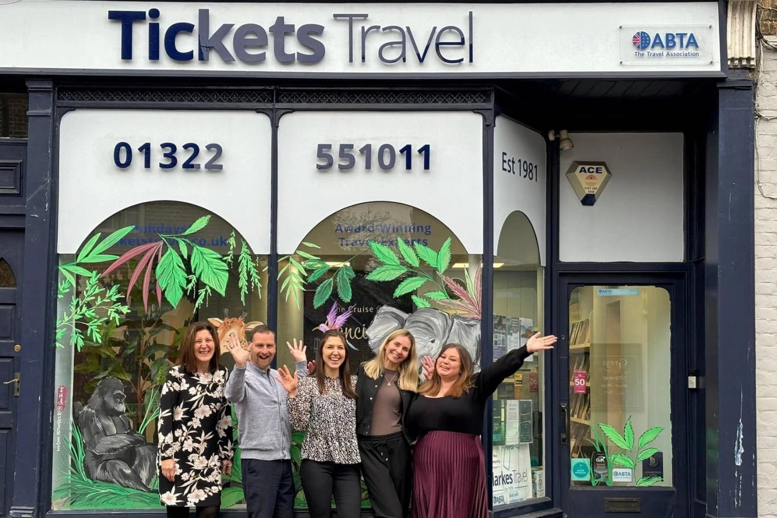 Tickets Travel team outside shopfront
