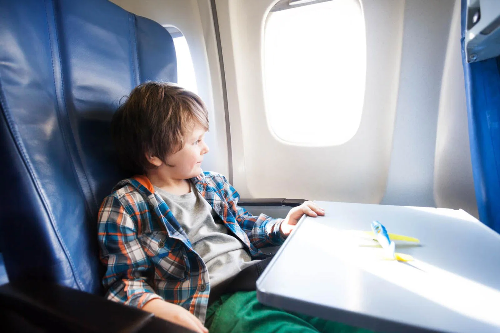 Boy on aircraft (stock)