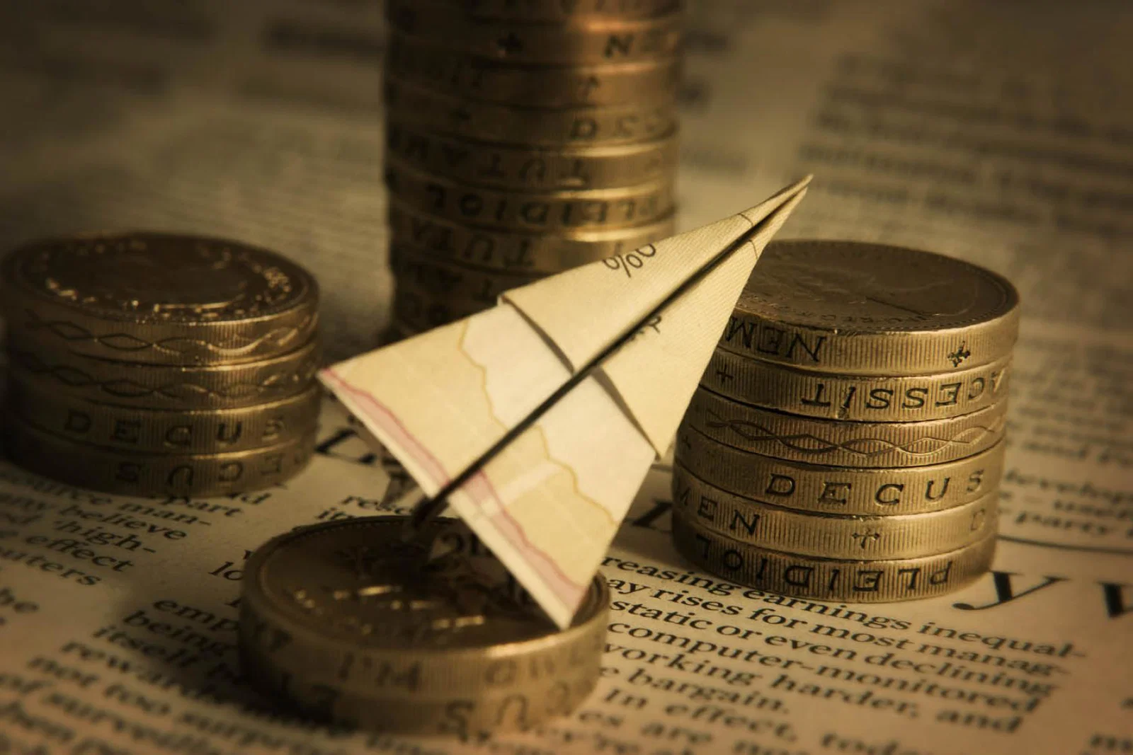 APD - paper plane, pound coins (stock)