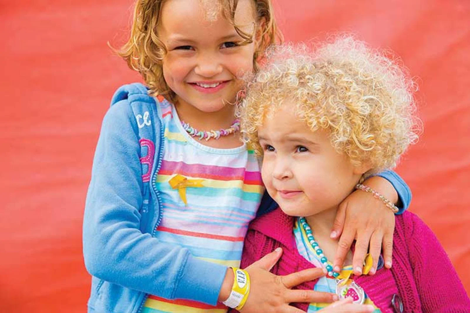 Phoebe (left) was helped by research funded by Children with Cancer UK