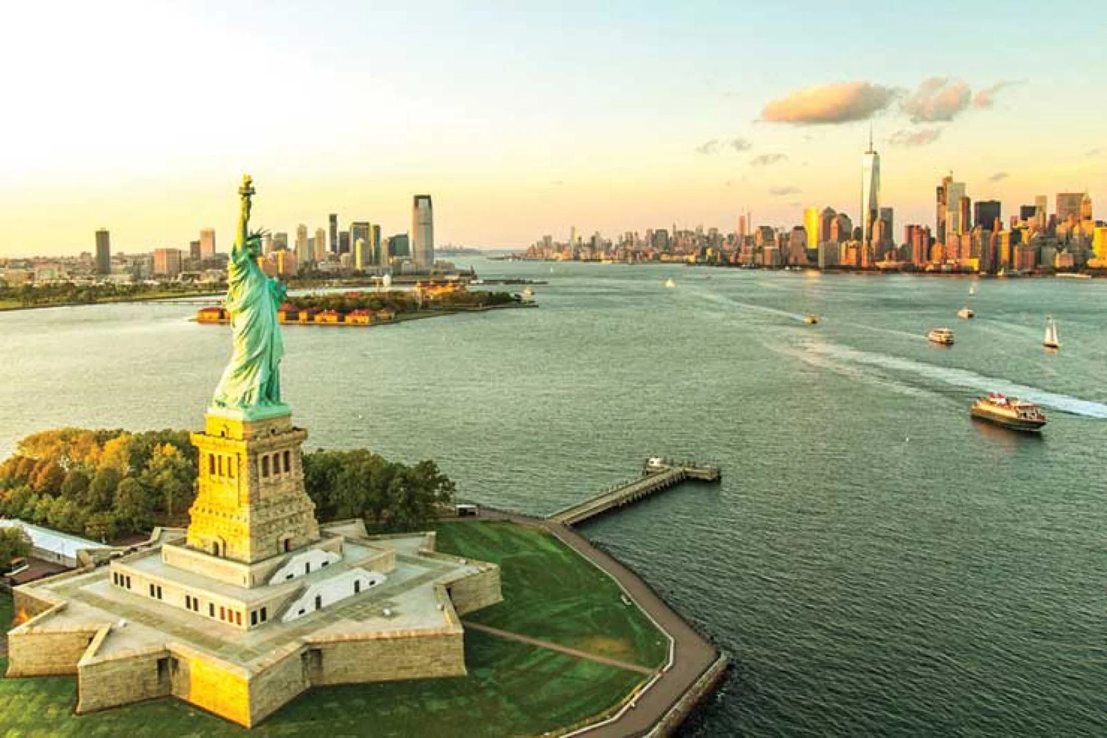 Statue of Liberty, Manhattan background iStock-608615480