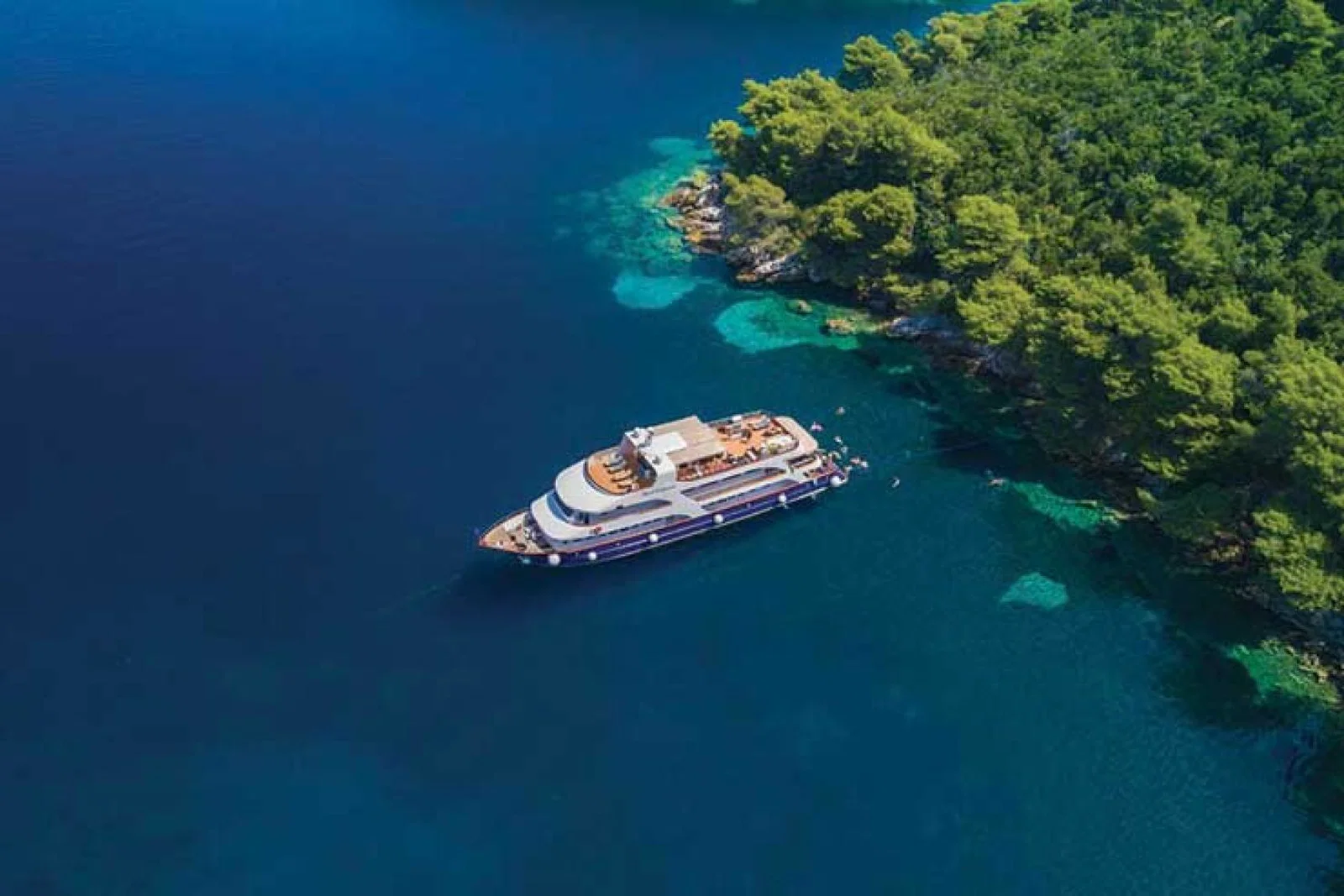 Yacht in crystal blue waters