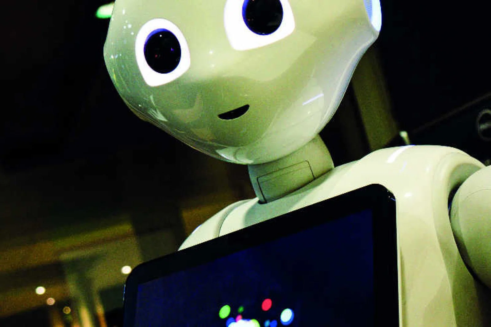 AI Robot holding tablet_Photo by Owen Beard on Unsplash.jpg
