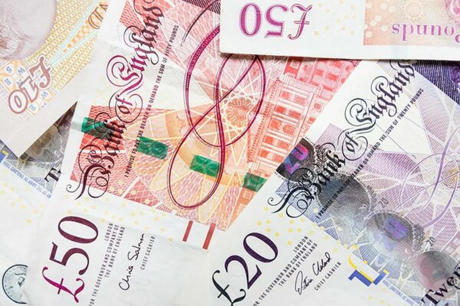 50 pound and 20 pound notes cash money sterling.jpg