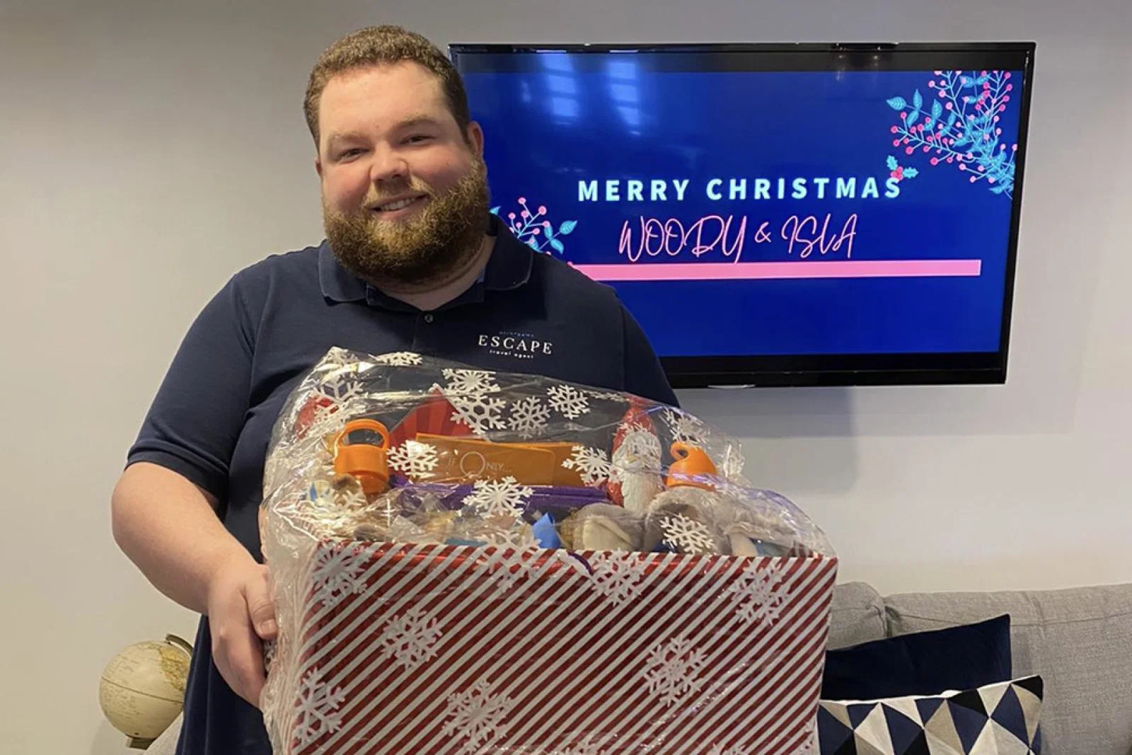 Ryan Sowney with gifts from Arrange My Escape to Isla and Woody