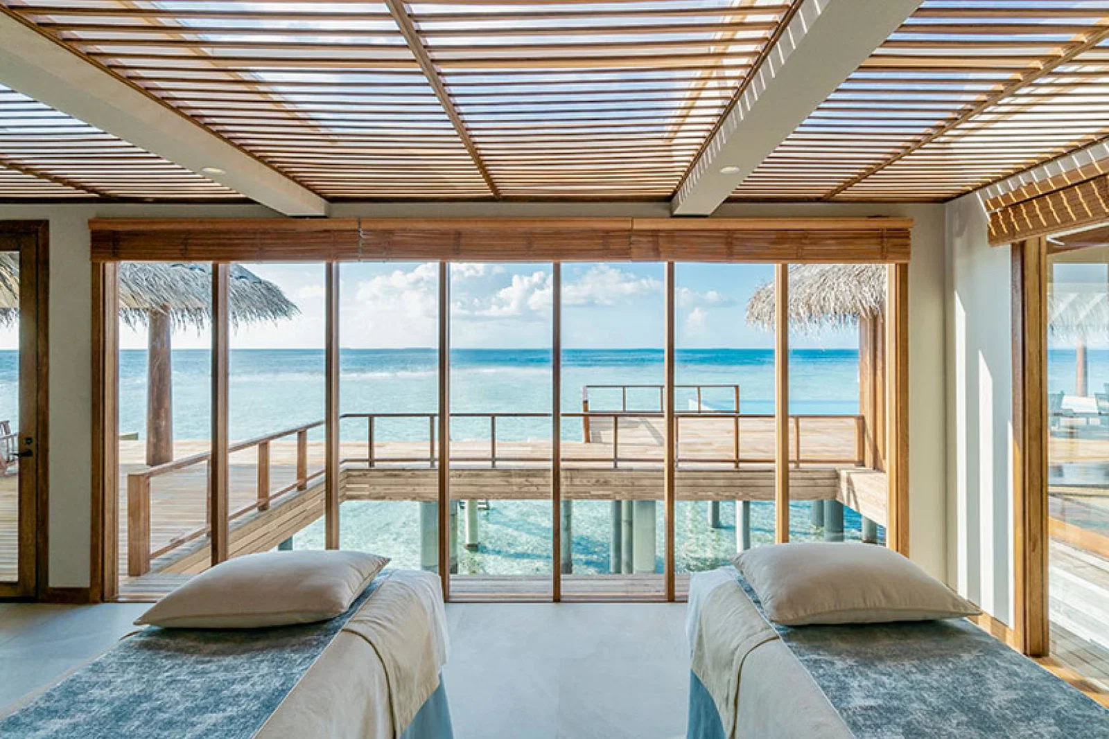 Anantara Kihavah's two-bedroom overwater pool residence's spa treatment room