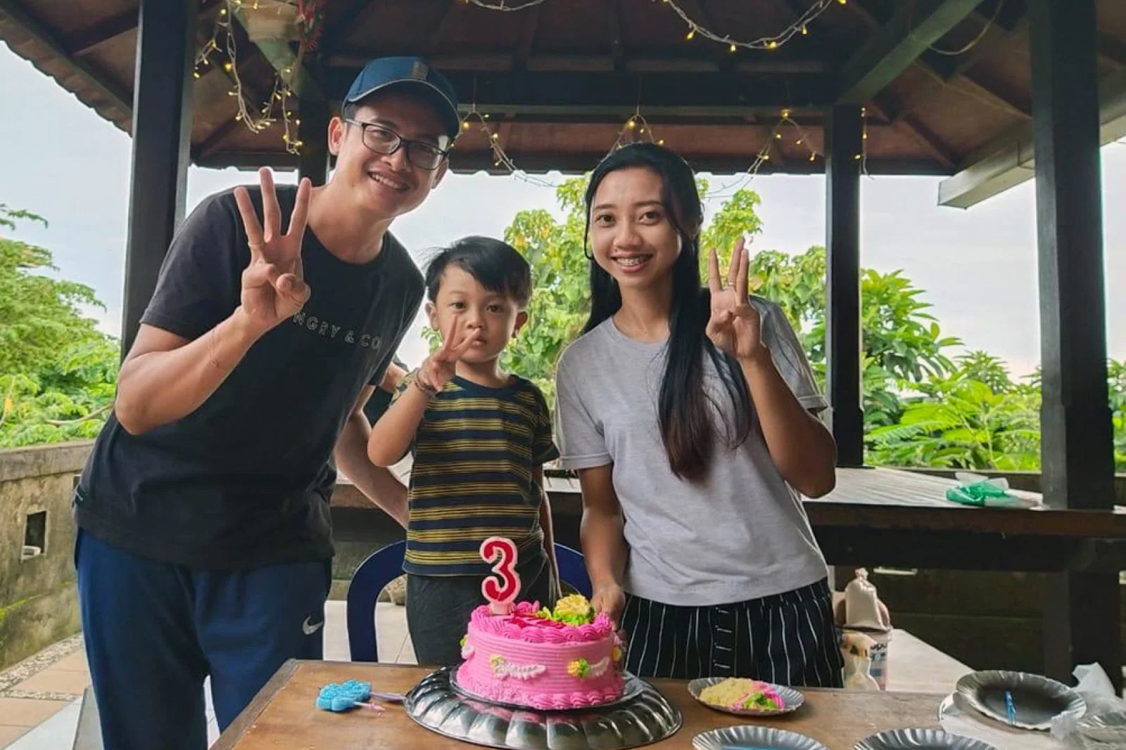 Kadek and Raithe Wikan celebrate with Ages on his third birthday