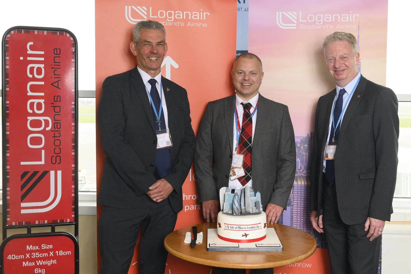 Tim Crookhall, Isle of Man minister for infrastructure, with Loganair's Jonathan Hinkles (centre) and Dr Alex Allinson, enterprise minister 