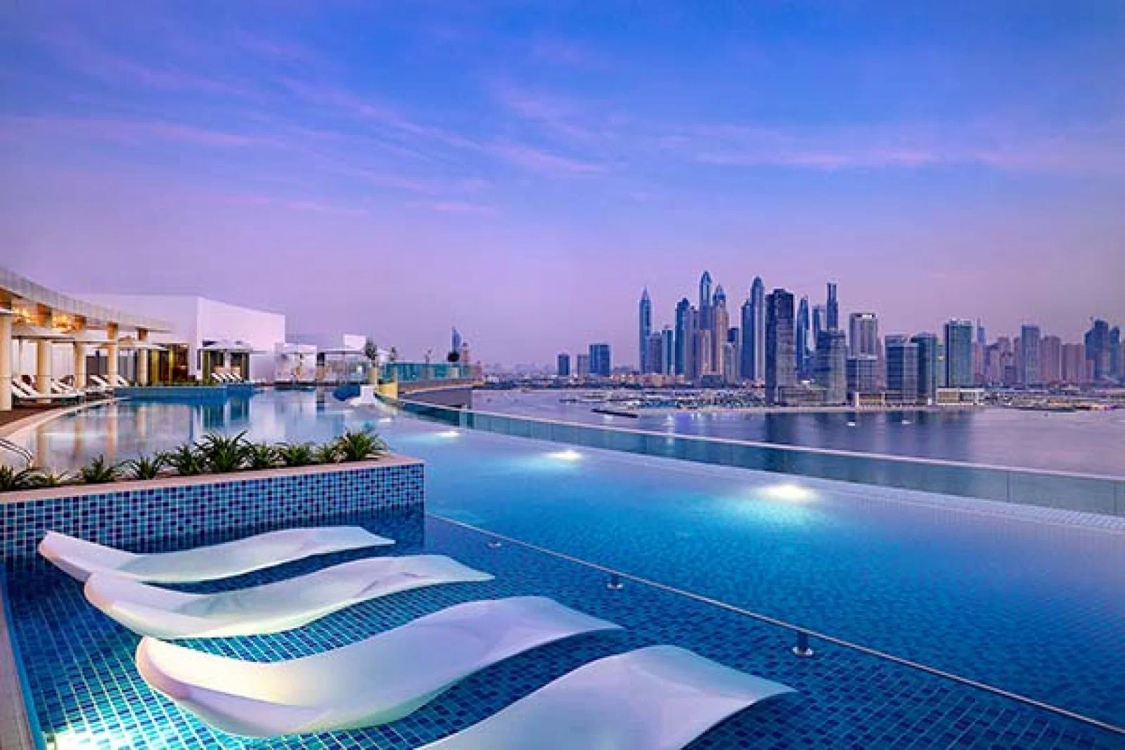 The temperature-controlled rooftop infinity pool at the NH Collection Dubai The Palm 