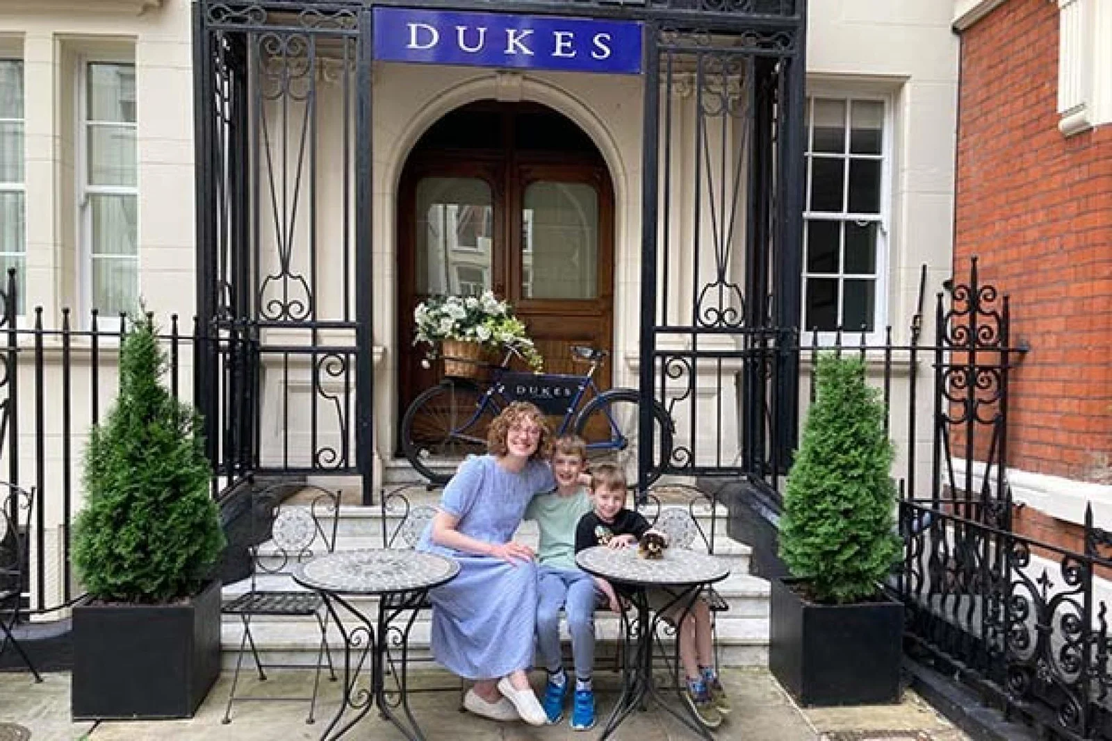 TTG Luxury's Charlotte and her sons outside Dukes London