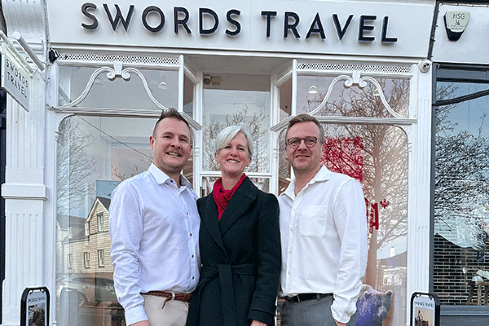 Sonia Davies of Scott Dunn with Stuart and Mark Swords at their Wimbledon store 