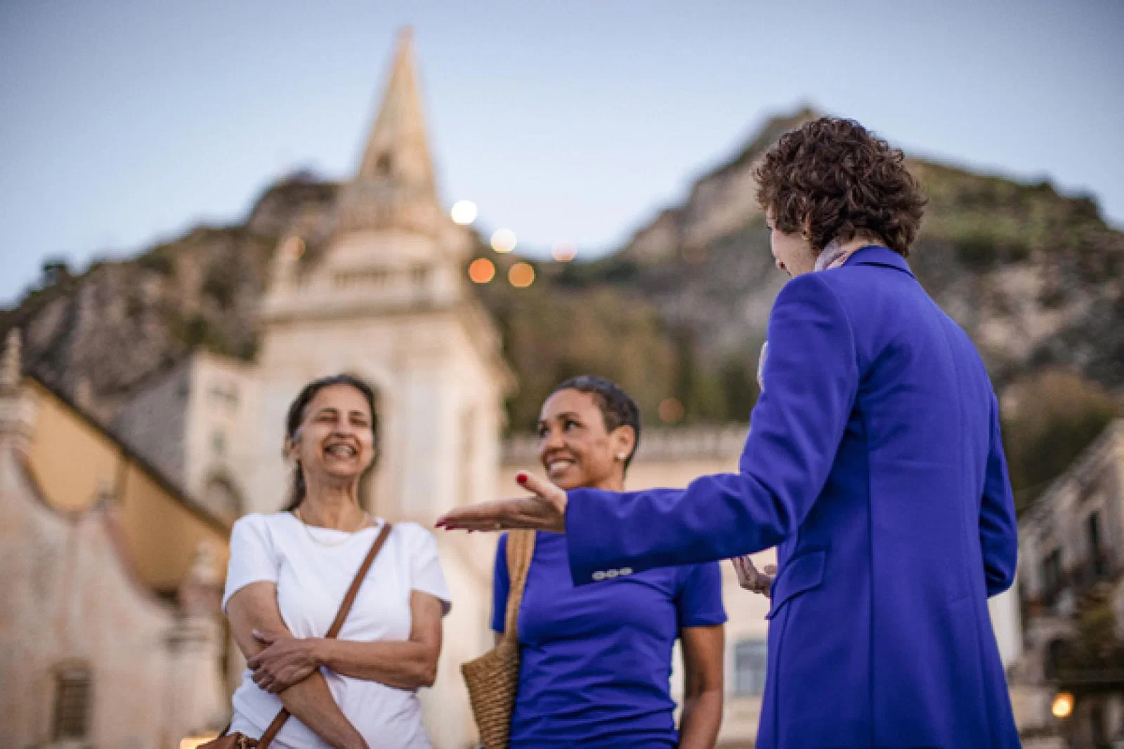Local expert with guests at sunrise in Taormina_Insight Vacations_March 2024.jpg
