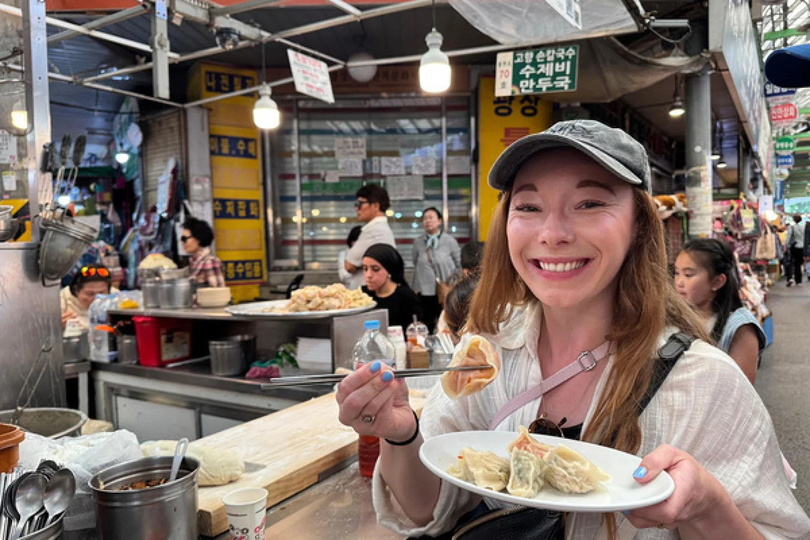 Our writer Madeleine Barber in Gwangjang Market, Seoul