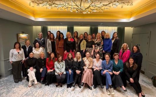 Large group of women smiling 