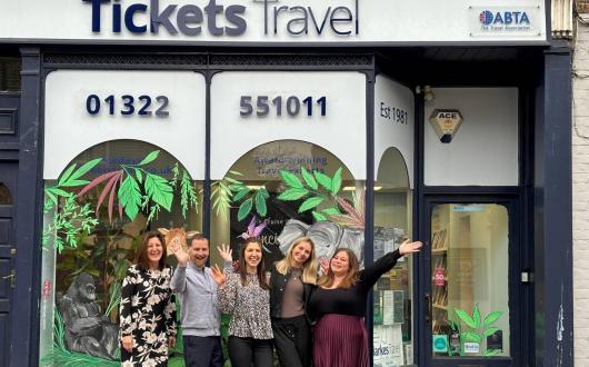 Tickets Travel team outside shopfront