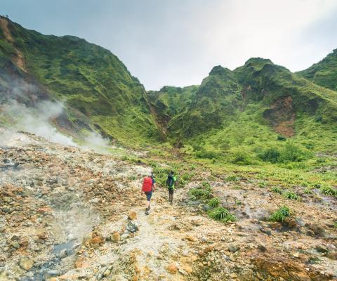 Two hikers on a trail in Dominica