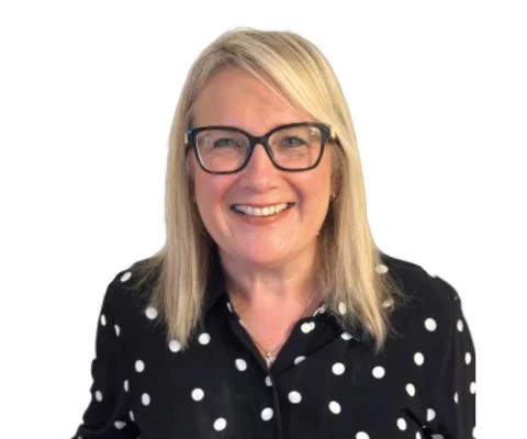 Smiling woman with blonde hair and glasses