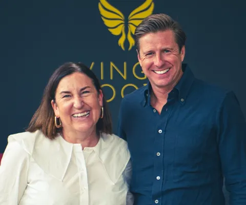April Hutchinson TTG and David Ox stand in Winged Boots shop
