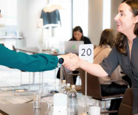 Supplier and travel advisor shaking hands