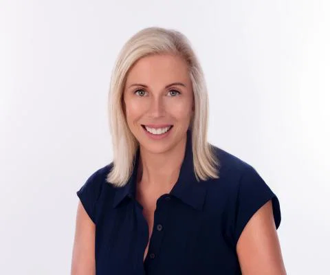 Headshot of woman with shoulder-length blonde hair smiling 