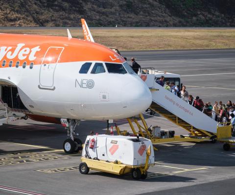 Passengers board an easyJet aircraft in Funchal