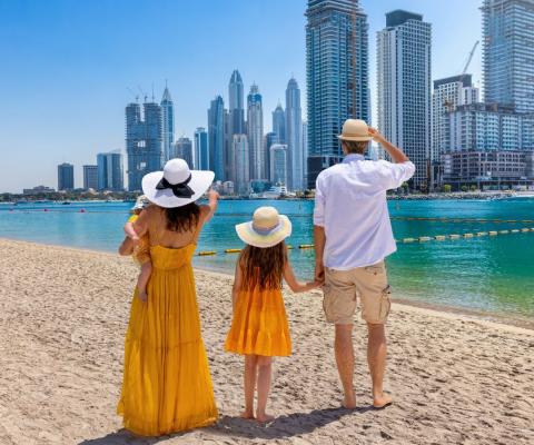 Family in front of Dubai marina skyline