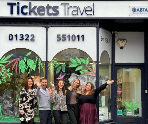 Tickets Travel team outside shopfront