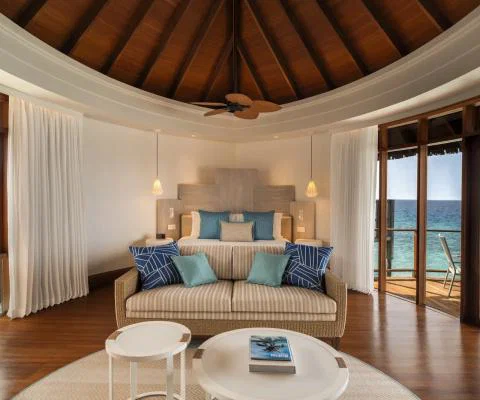 Constance Halaveli Maldives water villa bedroom