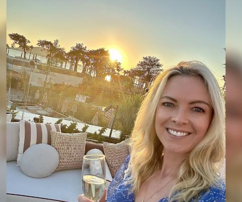 Blonde woman smiling with champagne 