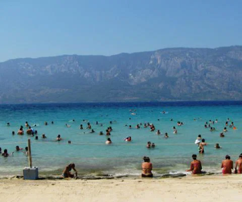 A_group_of_tourists_swimming_in_Sedir_Island_Cleopatra_beach.jpg