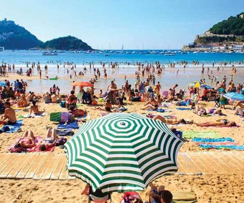 Busy Mediterranean beach iStock_47175536