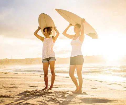Female surfers on the beach