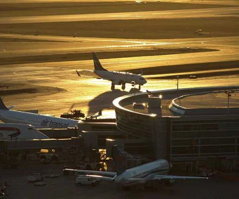 Jets at terminal at sunset