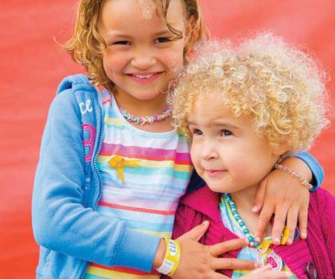 Phoebe (left) was helped by research funded by Children with Cancer UK