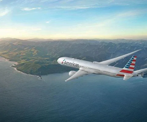 Photo_of_AA_777-300_over_coastline11050x7360.jpg