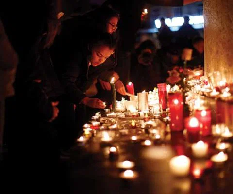 Mourners pay their respects. Photo Credit: Getty Images